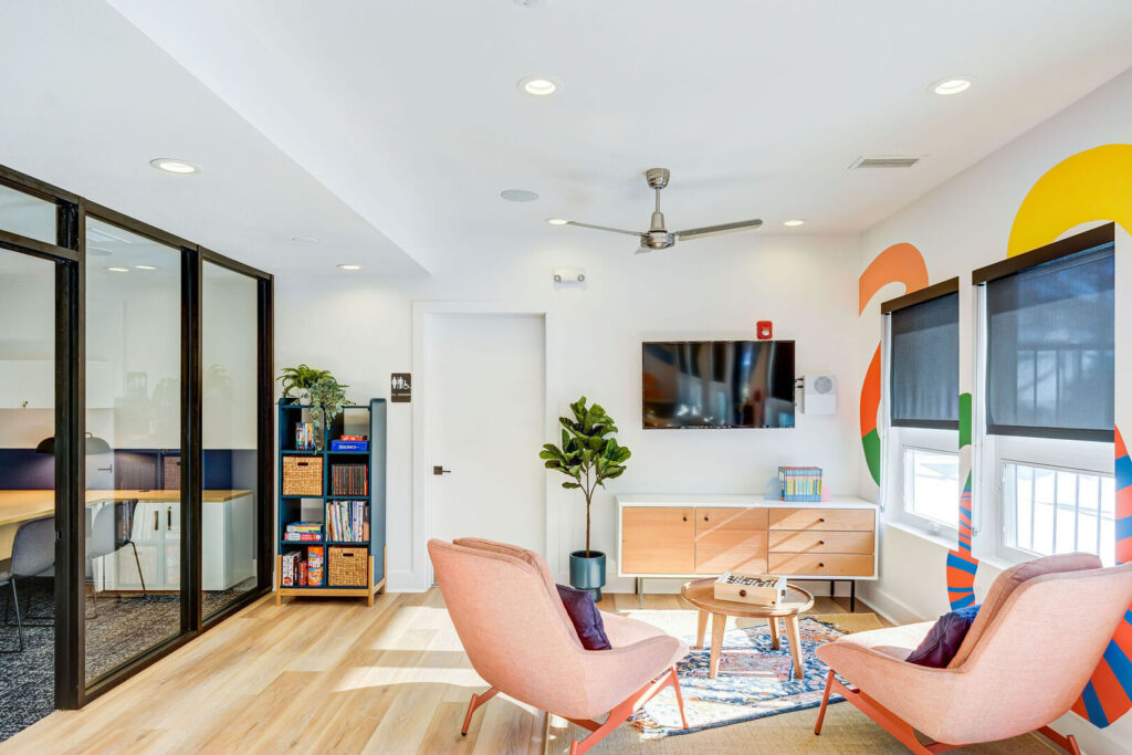 Kid's club room, with lounge seating, games, and books