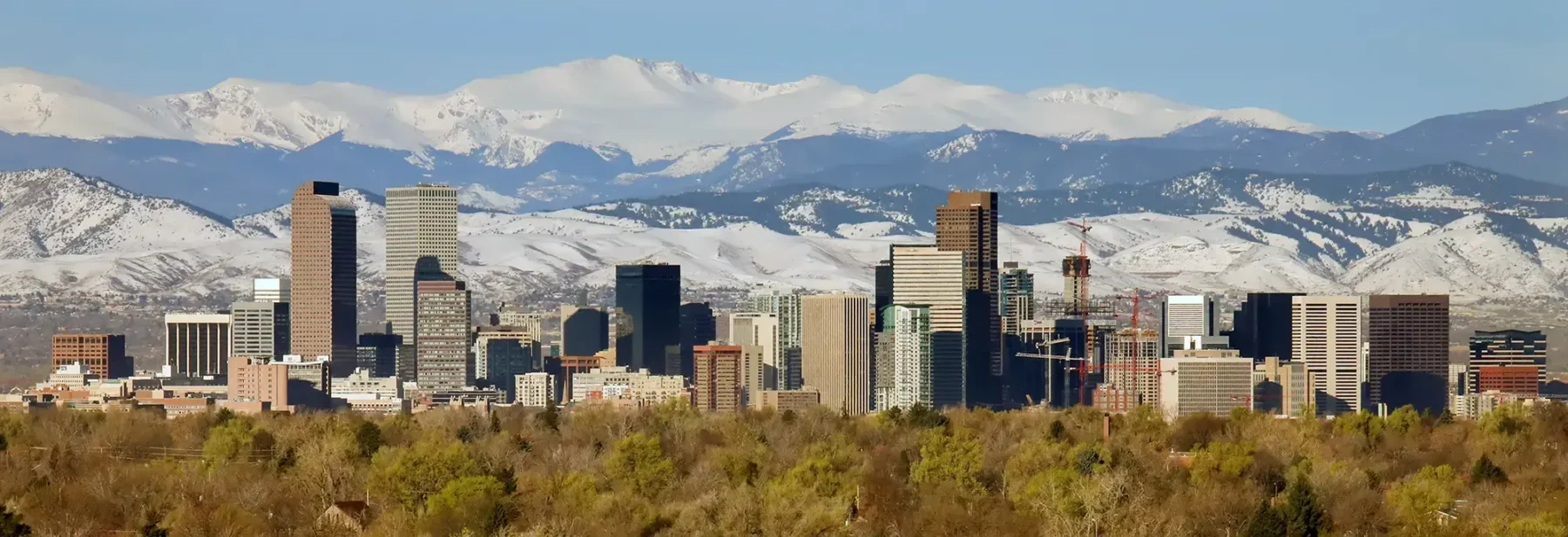 Denver Colorado skyline with mountains in the background