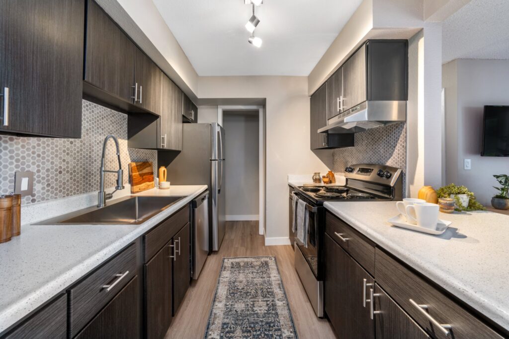 Ktichen with stainless steel appliances at Tuscan Heights apartments in Westminster, CO